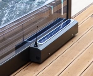 A pool enclosure with a weatherproof motor on it