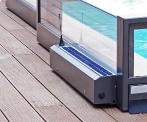 A pool enclosure with a solar powered motor attached